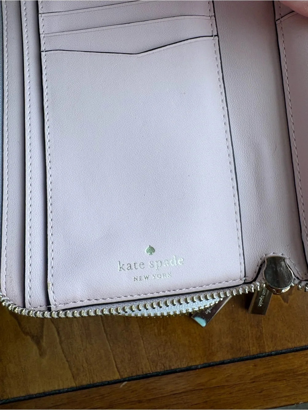 kate spade light pink zip-around wristlet wallet